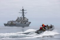 Members of a U.S. Coast Guard Law Enforcement Detachment and U.S. Navy Sailors assigned to the Arleigh Burke-class guided-missile destroyer USS Spruance (DDG 111) conduct small boat operations in the Pacific Ocean, March 26, 2025.