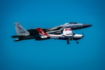 An F-15 fighter jet from the Florida Air National Guard’s 125th Fighter Wing, Detachment 1, intercepted a simulated Temporary Flight Restriction violator during a demonstration near Homestead Air Reserve Base, Florida, March 26, 2025. The exercise, coordinated with a Civil Air Patrol Cessna, highlighted the importance of TFR compliance and the teamwork and precision of NORAD pilots tasked with protecting North American airspace.