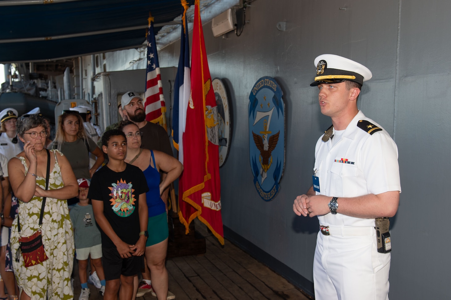 250427-N-RW305-1005 NOUMÉA, New Caledonia (April 27, 2025) – Ensign Conor McPherson, from Bel Air, Maryland, speaks to guests during a tour of the U.S. 7th Fleet flagship USS Blue Ridge (LCC 19) during a port visit in Nouméa, New Caledonia, April 27, 2025. The Blue Ridge and embarked U.S. 7th Fleet staff conduct regular Indo-Pacific patrols to deter aggression, strengthen alliances and partnerships, and advance future warfighting capabilities. (U.S. Navy photo by Mass Communication Specialist 3rd Class Thomas Furnish)