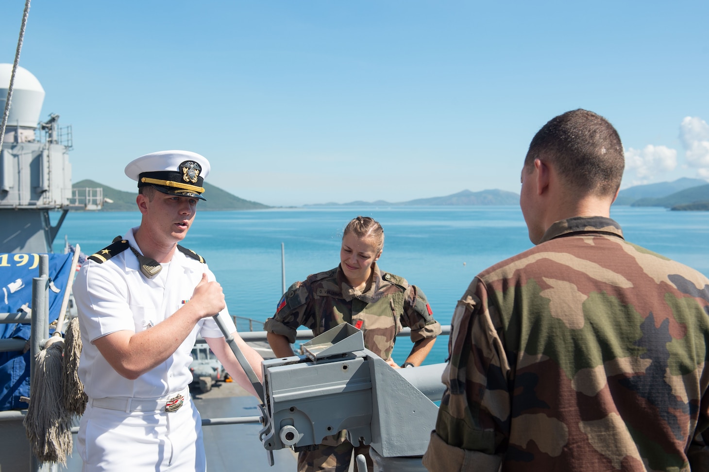 250427-N-RW305-1138 NOUMÉA, New Caledonia (April 27, 2025) – Ensign Conor McPherson, from Bel Air, Maryland, speaks to members of the French Land Army during a tour of the U.S. 7th Fleet flagship USS Blue Ridge (LCC 19), during a port visit in Nouméa, New Caledonia, April 27, 2025. The Blue Ridge and embarked U.S. 7th Fleet staff conduct regular Indo-Pacific patrols to deter aggression, strengthen alliances and partnerships, and advance future warfighting capabilities. (U.S. Navy photo by Mass Communication Specialist 3rd Class Thomas Furnish)