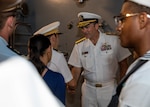 250428-N-PH222-2001 NOUMÉA, New Caledonia (April 28, 2025) Rear Adm. Kyle Gantt, deputy commander, U.S. 7th Fleet, welcomes guests during a big top reception aboard the U.S. 7th Fleet flagship USS Blue Ridge (LCC 19), while in Nouméa, New Caledonia, April 28, 2025. The Blue Ridge and embarked 7th Fleet staff are in New Caledonia for a scheduled port visit. Blue Ridge and the 7th Fleet staff conduct regular Indo-Pacific patrols to deter aggression, strengthen alliances and partnerships, and advance future warfighting capabilities. (U.S. Navy photo by Mass Communication Specialist 1st Class Ryan M. Breeden)