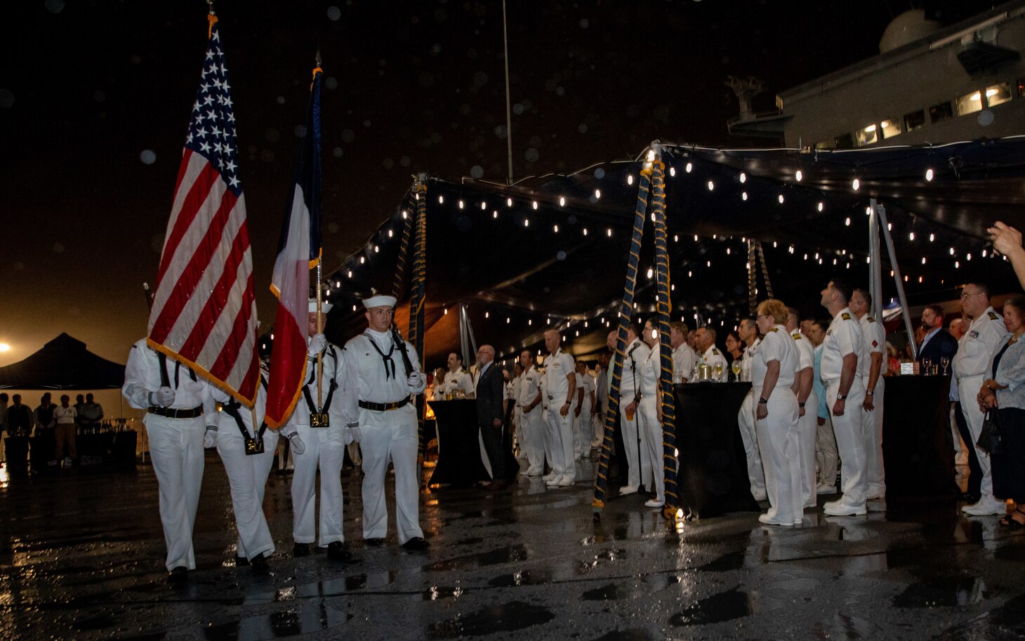 250428-N-PH222-2007 NOUMÉA, New Caledonia (April 28, 2025) The color guard parades the colors during a big top reception aboard the U.S. 7th Fleet flagship USS Blue Ridge (LCC 19), in Nouméa, New Caledonia, April 28, 2025. The Blue Ridge and embarked 7th Fleet staff are in New Caledonia for a scheduled port visit. Blue Ridge and the 7th Fleet staff conduct regular Indo-Pacific patrols to deter aggression, strengthen alliances and partnerships, and advance future warfighting capabilities. (U.S. Navy photo by Mass Communication Specialist 1st Class Ryan M. Breeden)
