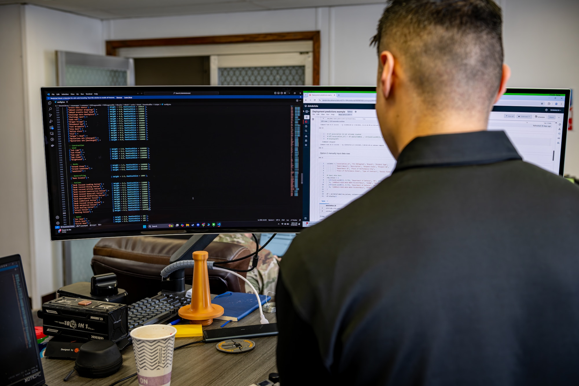 A man checks coding at a computer.
