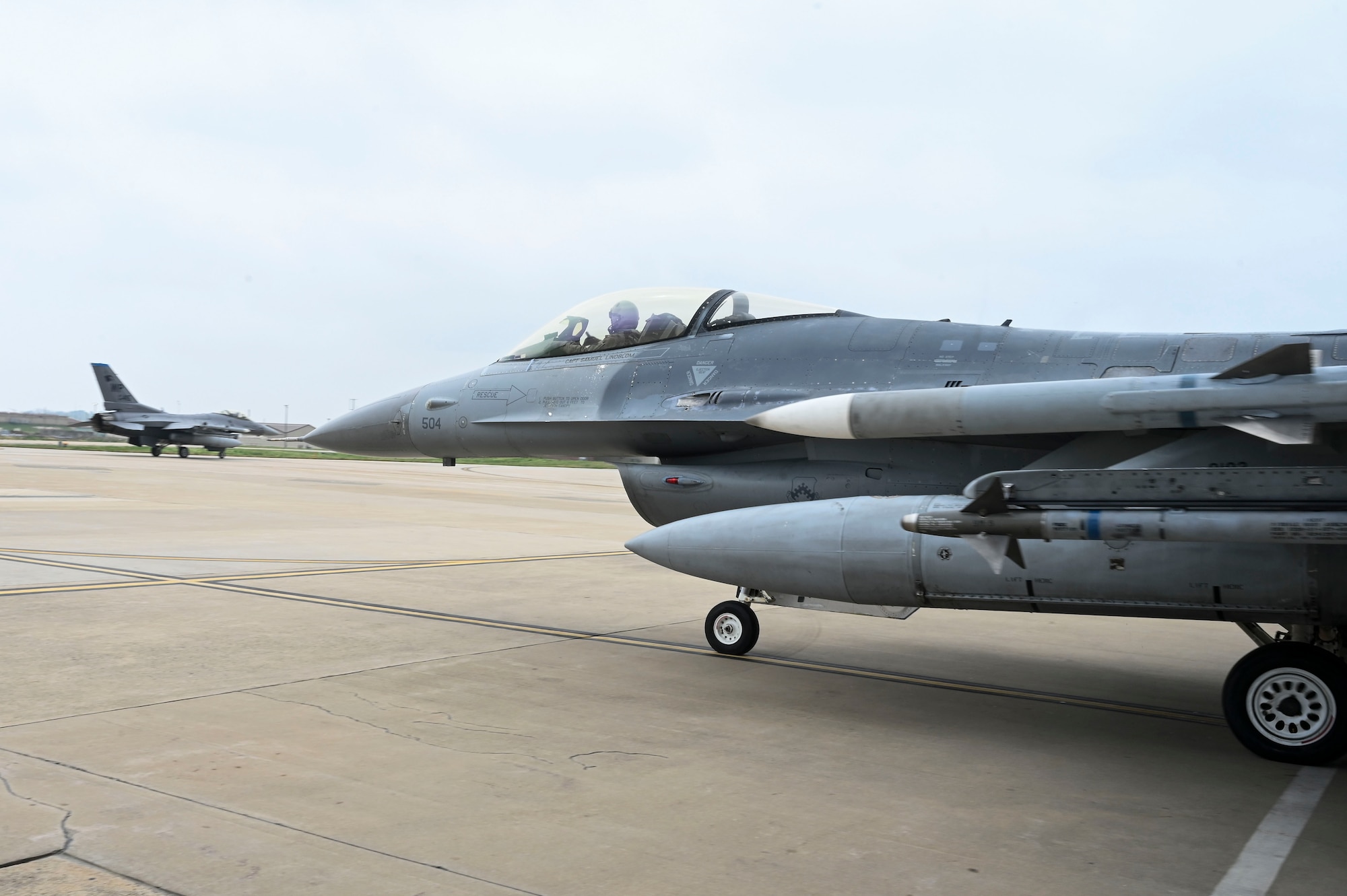 An F-16 Fighting Falcon aircraft, piloted by U.S. Air Force Col. Peter "Wolf" Kasarskis, 8th Fighter Wing commander, taxis out of a hangar during exercise Freedom Flag 25-1 at Kunsan Air Base, Republic of Korea, April 23, 2025.