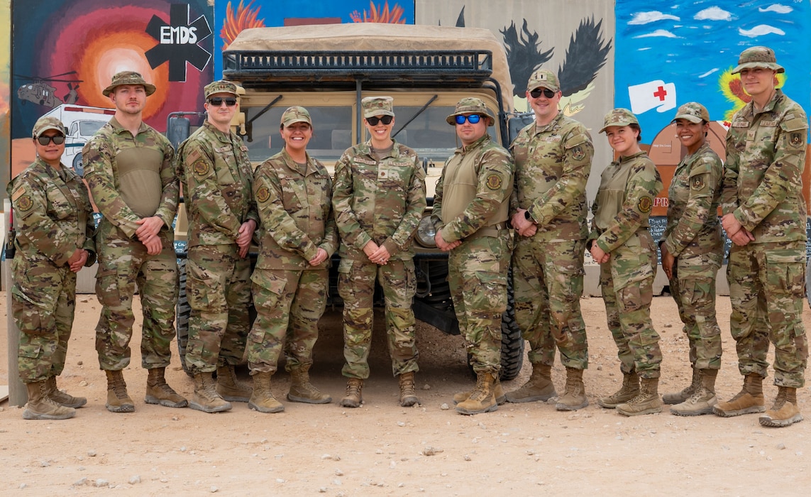A group of Airmen pose for a photo.