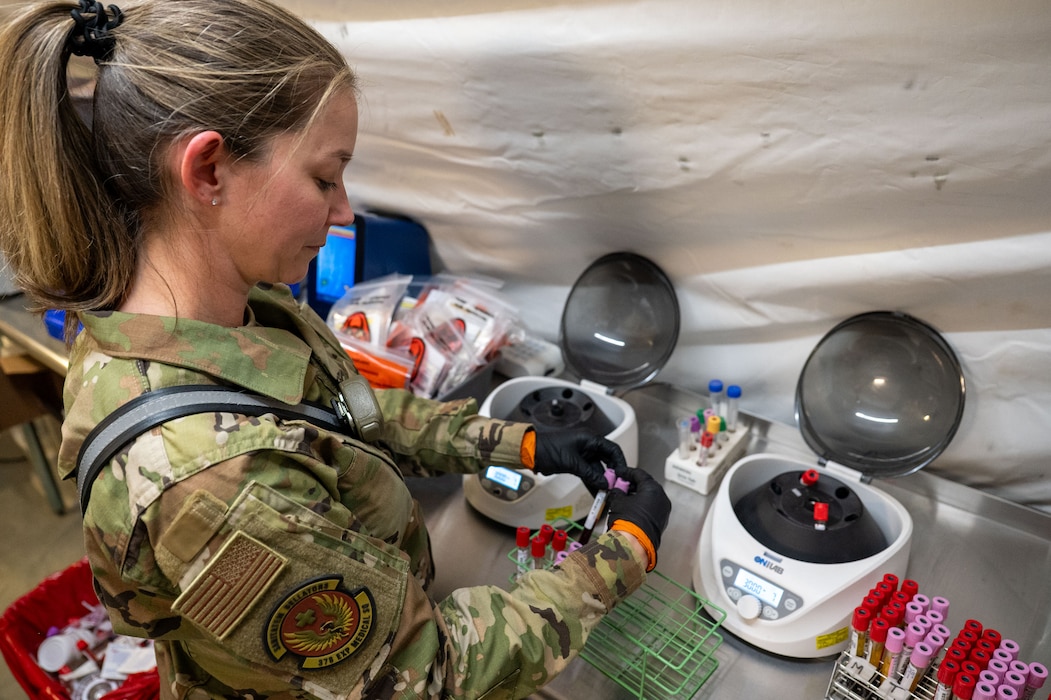 An Airman organizes blood samples to prepare them for blood typing.