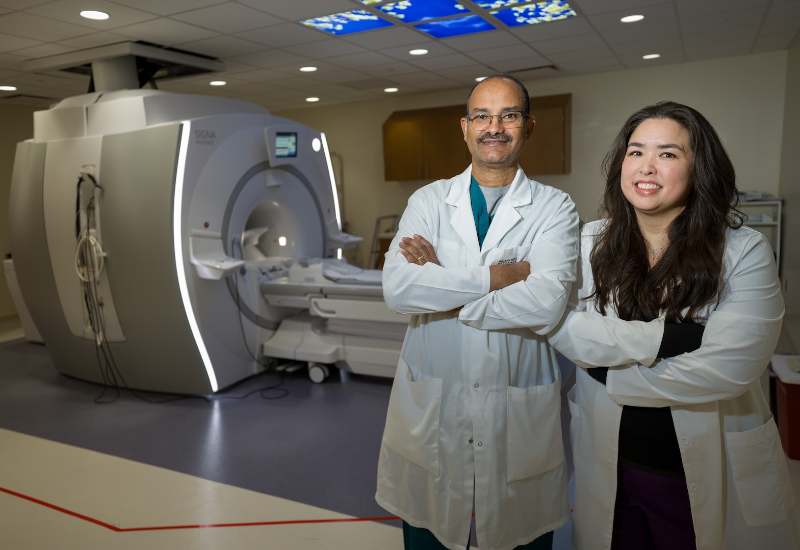 Lareina Ng, Chief magnetic resonance imaging (MRI) Tech, and Hailu Woldemichael, MRI Tech, stand in the MRI Liberty suite at the new Roosevelt Pavilion, Walter Reed National Military Medical Center, Bethesda, Md., on Apr. 28, 2025. The facility features advanced imaging technology and offers state-of-the-art diagnostic capabilities at one of the nation’s premier military medical centers. (DOD photo by Ricardo J. Reyes)