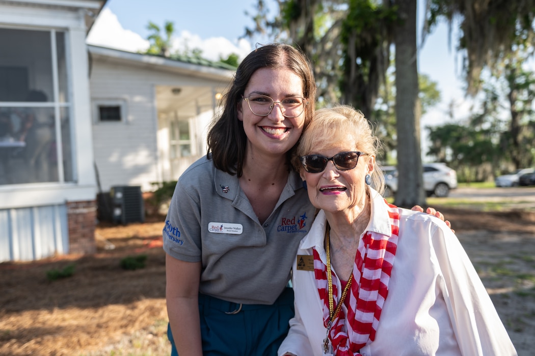 Jennifer Walker and Dr. Lucy pose for a photo.