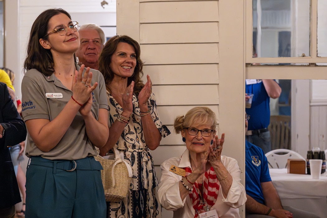 Members of the Red Carpet Committee are applauding.