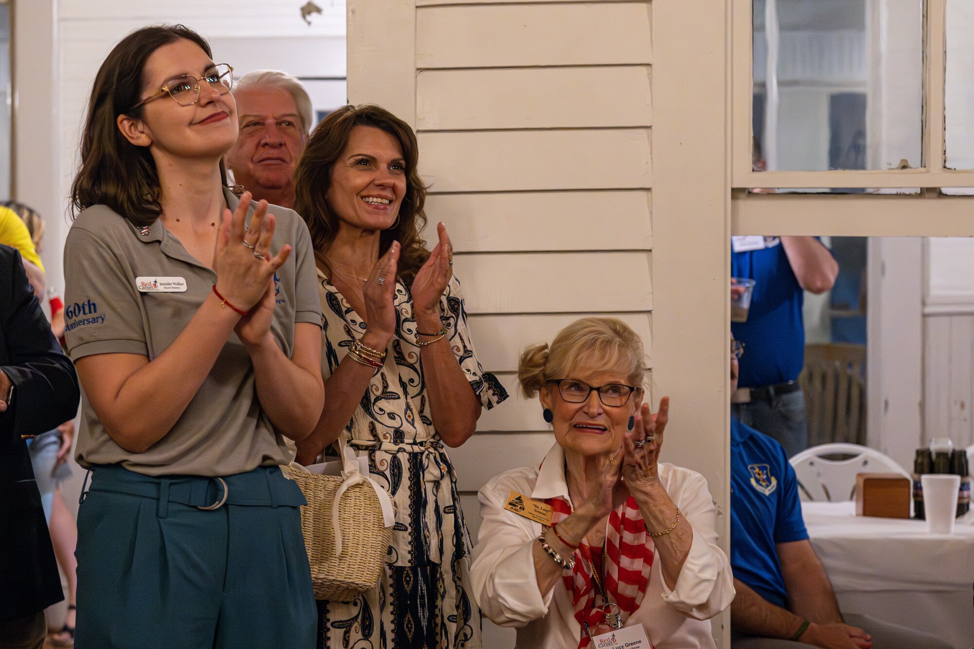 Members of the Red Carpet Committee are applauding.