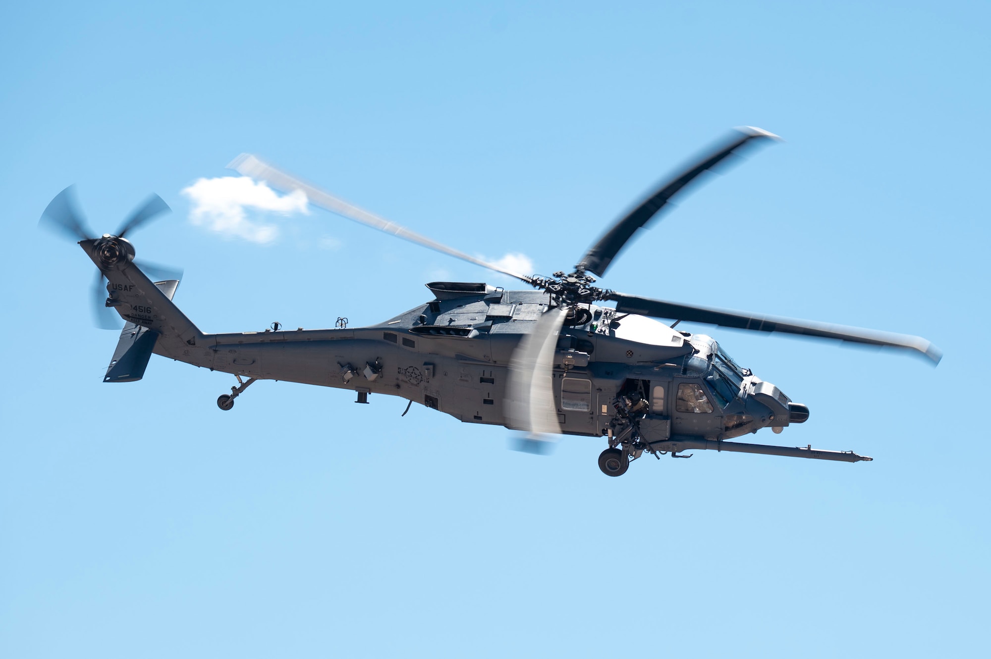 A U.S. Air Force HH-60W Jolly Green II assigned to the 55th Rescue Squadron performs evasive maneuvers during a training sortie at Gila Bend, Arizona, April 29, 2025. The HH-60W executed a training sortie to maintain combat readiness and operational effectiveness that supports critical missions such as personnel recovery and disaster response. (U.S. Air Force photo by Airman Samantha Melecio)
