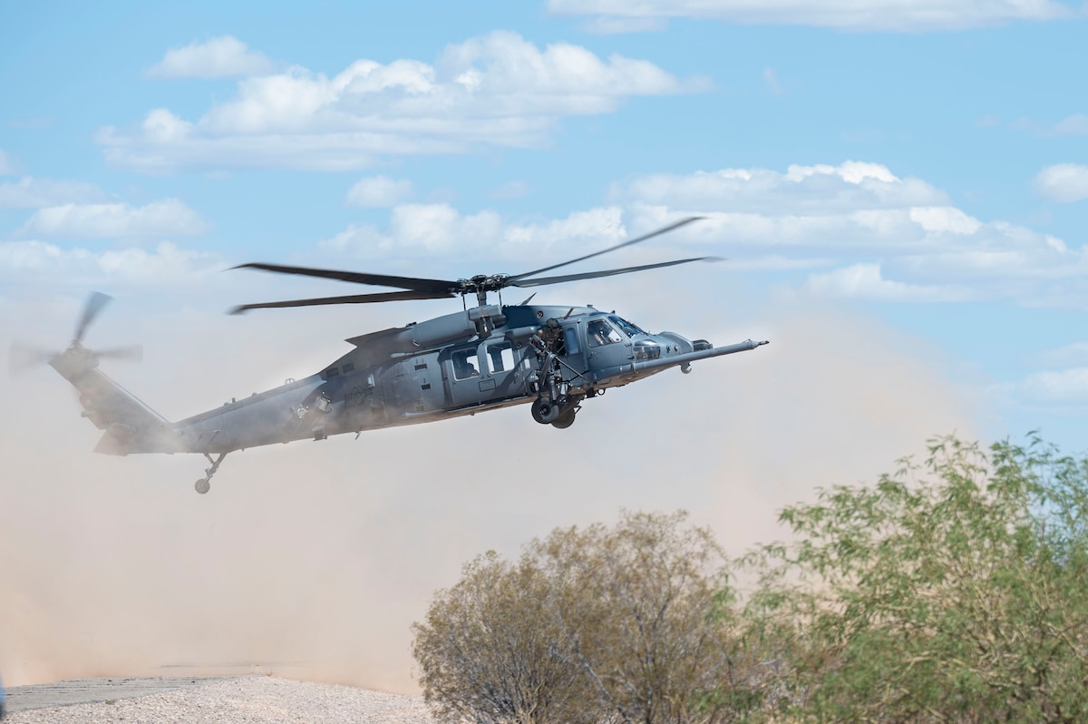 A U.S. Air Force HH-60W Jolly Green II helicopter assigned to the 55th Rescue Squadron lands during a training sortie at Gila Bend, Arizona, April 29, 2025. The HH-60W was designed for mission critical operations to include personnel recovery, humanitarian missions, civilian search and rescue, disaster relief, medical evacuation and non-combatant evacuations. (U.S. Air Force photo by Airman Samantha Melecio)