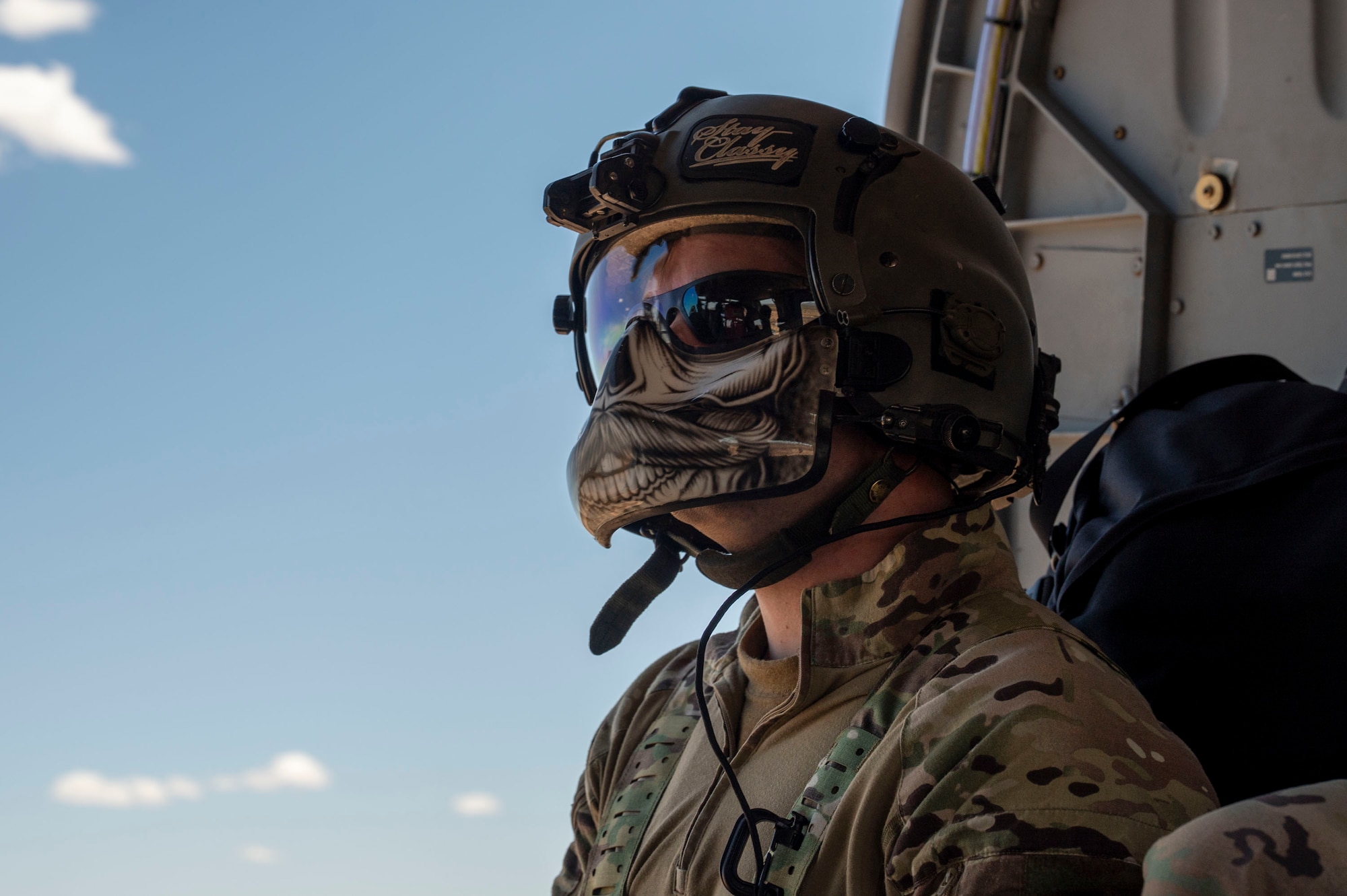 A U.S. Air Force pararescueman assigned to the 55th Rescue Squadron looks ahead while on an HH-60W Jolly Green II helicopter near Gila Bend, Arizona, April 29, 2025. The 55th RQS conducts extensive training in various rescue scenarios to ensure they are ready to effectively respond to real-world contingencies. (U.S. Air Force photo by Airman Samantha Melecio)