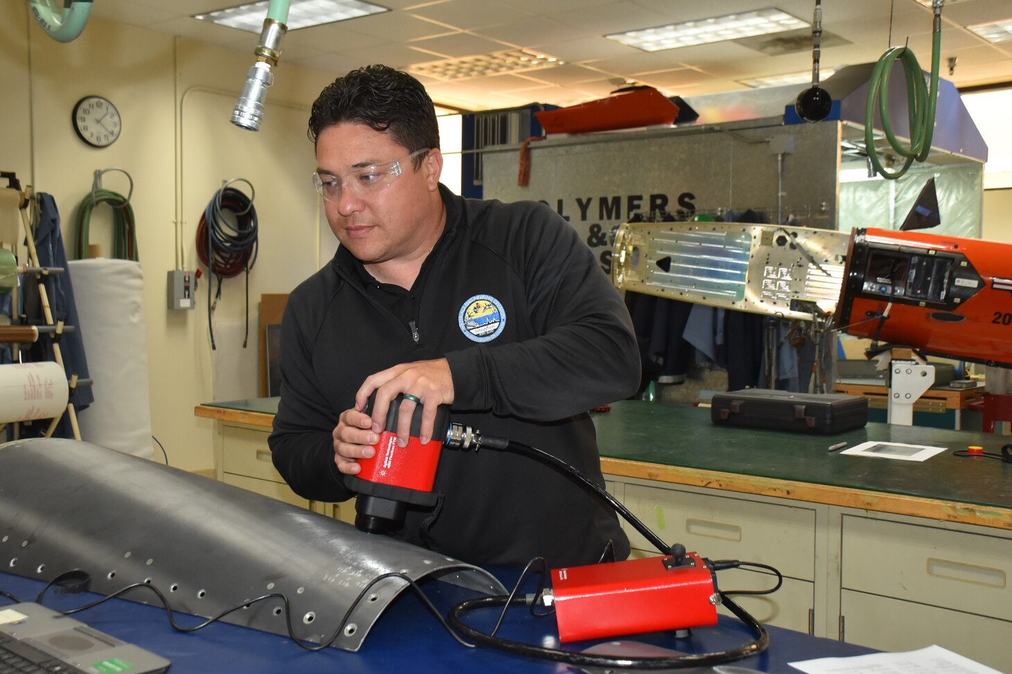 FRCSW engineer Dr. Justin Massey demonstrates composite damage assessment using advanced inspection technology.