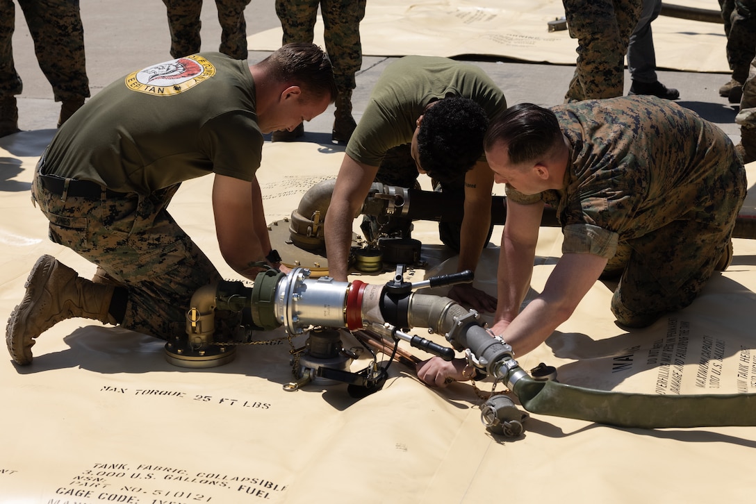 U.S. Marine Corps Sgt. Wilfredo Huitroncampista, a bulk fuel specialist with Marine Wing Support Squadron 373, Marine Air Control Group 38, 3rd Marine Aircraft Wing, disassembles a collapsible fuel tank during Tactical Air-Ground Refueling Sysytem New Equipment Training at Marien Air Station Miramar, California, April 24, 2025.