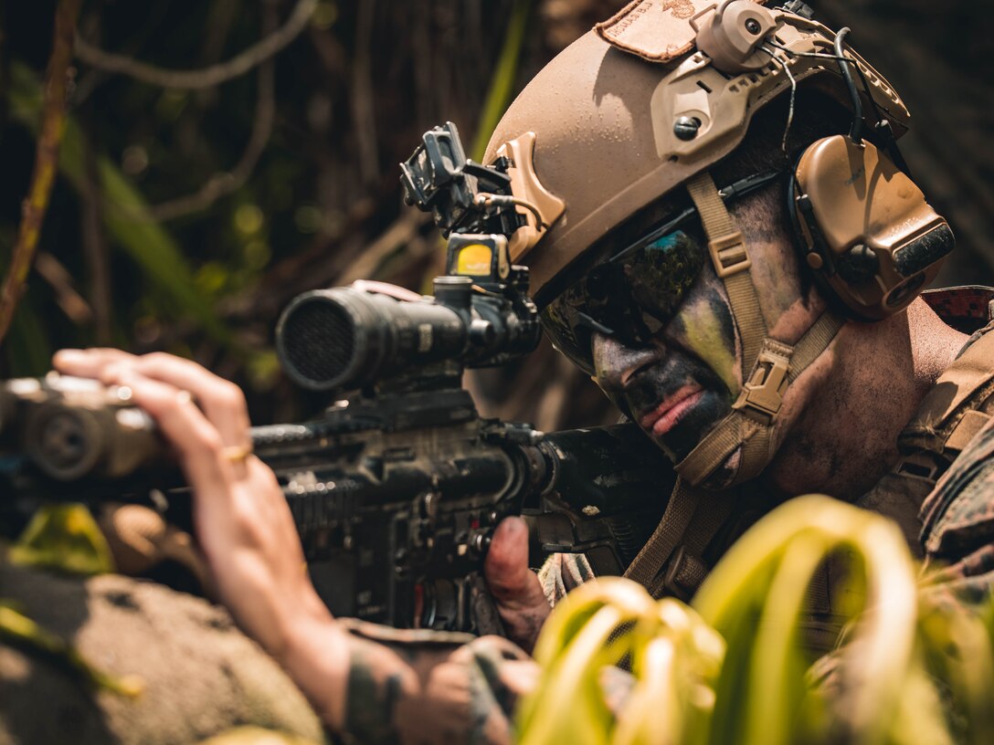 U.S. Marine Corps Cpl. Leonardo Vernalha, a team leader with 2nd Battalion, 1st Marine Regiment, Marine Rotational Force – Darwin 25.3 sights in an M27 infantry automatic rifle during a counter-landing live-fire rehearsal in support of Exercise Balikatan 25 at Rizal, Palawan, Philippines, April 27, 2025.