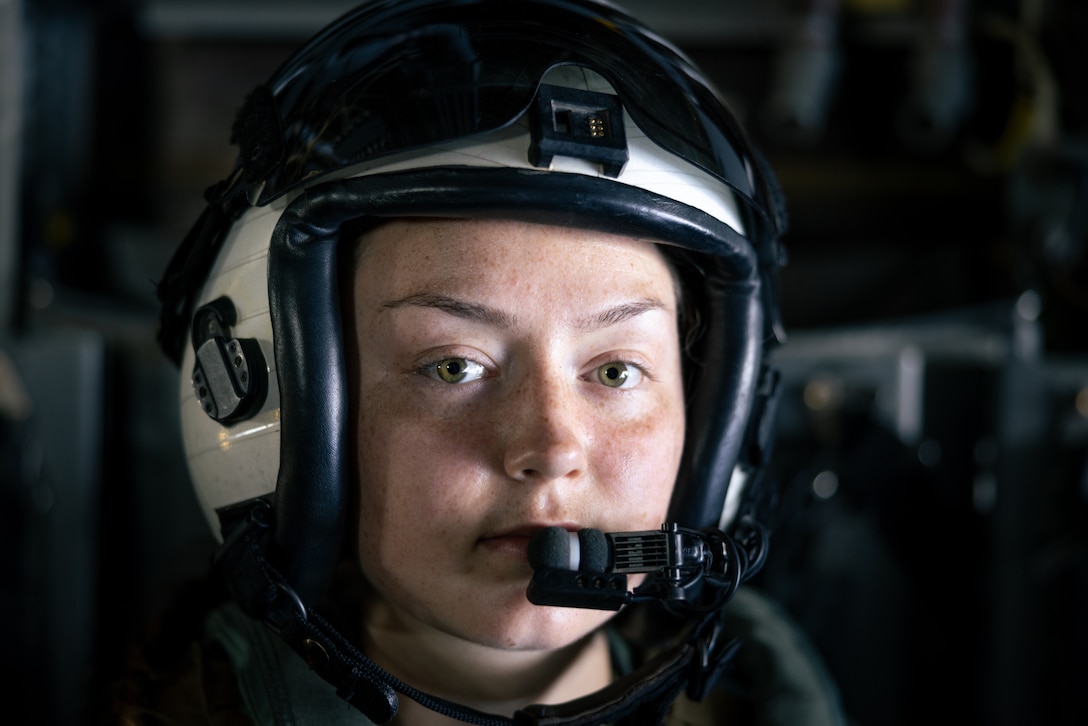 U.S. Marine Corps Cpl. Mackenzie Larson, an MV-22B Osprey crew chief with Marine Medium Tiltrotor Squadron (VMM) 364, Marine Air Group 39, 3rd Marine Aircraft Wing, poses for a portrait during a simulated tactical recovery of aircraft and personnel exercise during Exercise Balikatan 25 over the South China Sea,April 28, 2025.