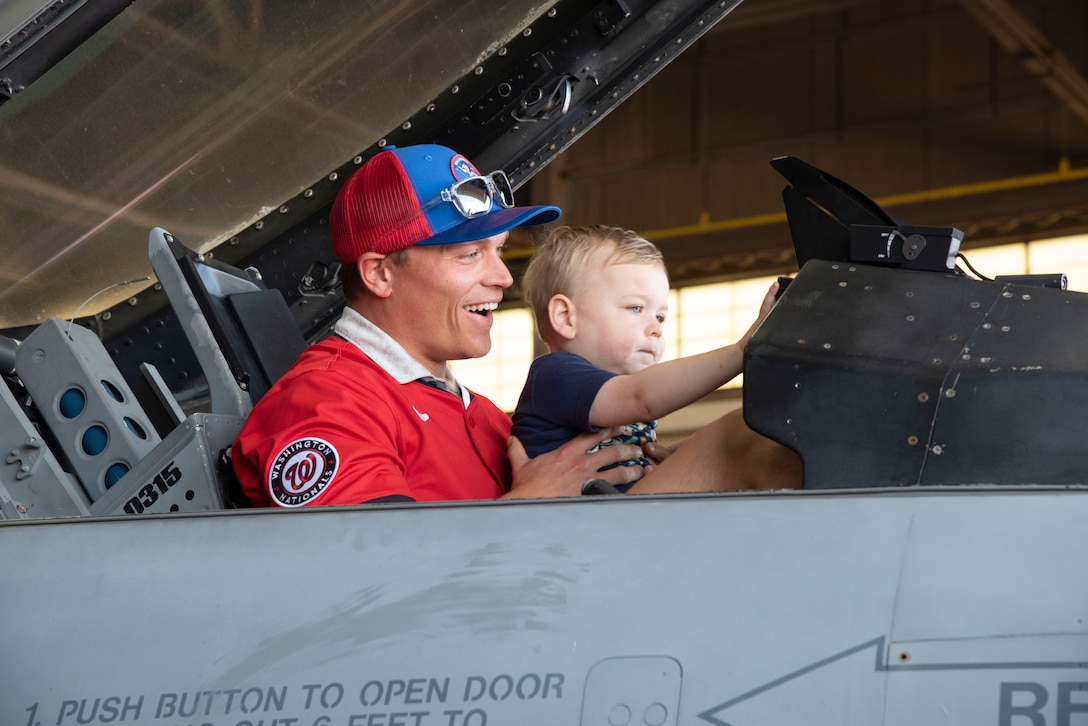 Alex Call, an outfielder with the Washington Nationals, and his son explore the cockpit of a F-16 Fighting Falcon aircraft, assigned to the 113th Wing, at Joint Base Andrews, Md., April 23, 2025.