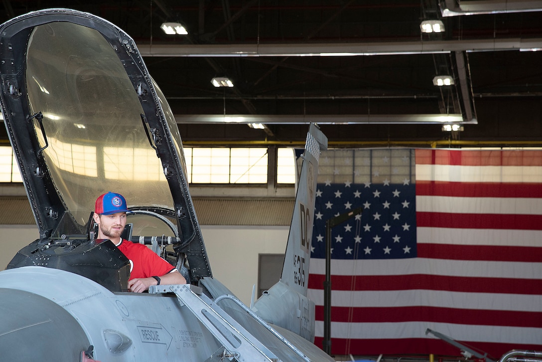 Michael Soroka, a pitcher with the Washington Nationals, sits in the cockpit of a 113th Wing F-16 Fighting Falcon aircraft at Joint Base Andrews, Md., April 23, 2025.