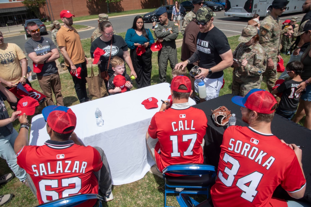 Eduardo Salazar, Alex Call and Michael Soroka of the Washington Nationals sign autographs at Joint Base Andrews, Md., April 23, 2025.