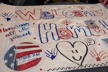 A poster for the veterans returning from the Western North Dakota Honor Flight  at Minot International Airport in Minot, N.D., April 28, 2025. The group returned from a two-day trip to Washington, D.C., where they visited war memorials and national landmarks built in their honor. (U.S. Air Force photo by Airman 1st Class Luis Gomez)