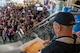 A veteran overlooks the cheering crowd during the Western North Dakota Honor Flight homecoming at Minot International Airport in Minot, N.D., April 28, 2025. Veterans were welcomed by family, friends and supporters after visiting Washington, D.C. memorials honoring their military service. (U.S. Air Force photo by Airman 1st Class Luis Gomez)