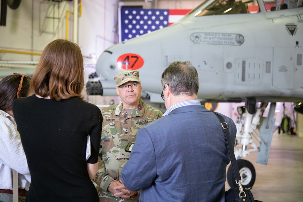 Uniformed military member speaking with civilian media