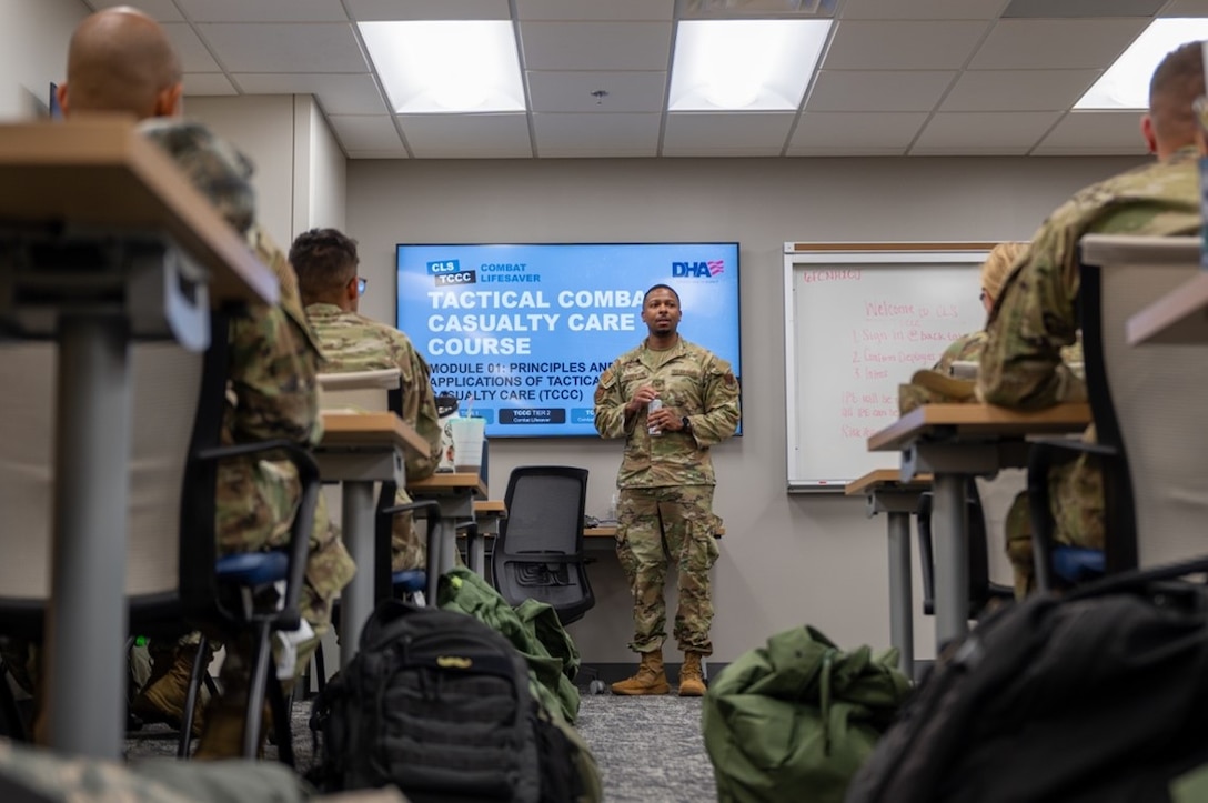 Airman stands in front of class whiteboard. (U.S. Air Force photo by Airman 1st Class Donnell Ramsey)