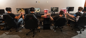 The Offutt Air Force Base esports team fist bump each other after completing a round of Call of Duty at the Offutt Event Center, March 7, 2025. The team is preparing to play in the Eastern Qualifier tournament at Patrick AFB on June 8-15. (U.S. Air Force photo by Chad Watkins)