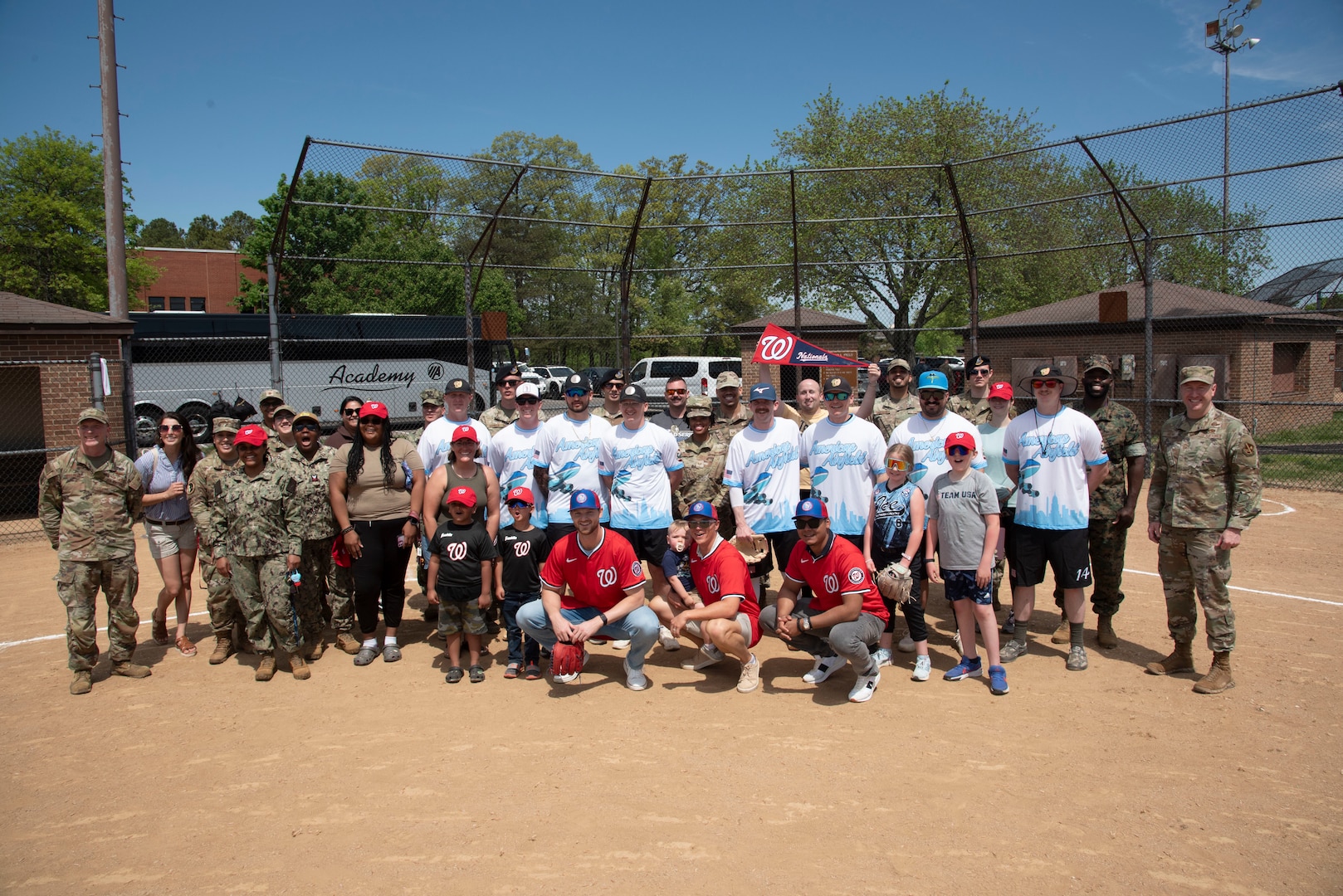 Michael Soroka, Alex Call and Eduardo Salazar of the Washington Nationals pose with service members and families at Joint Base Andrews, Md., April 23, 2025. The team visited military installations in the National Capital Region to gain a better understanding of the military’s mission, policies, and programs.
