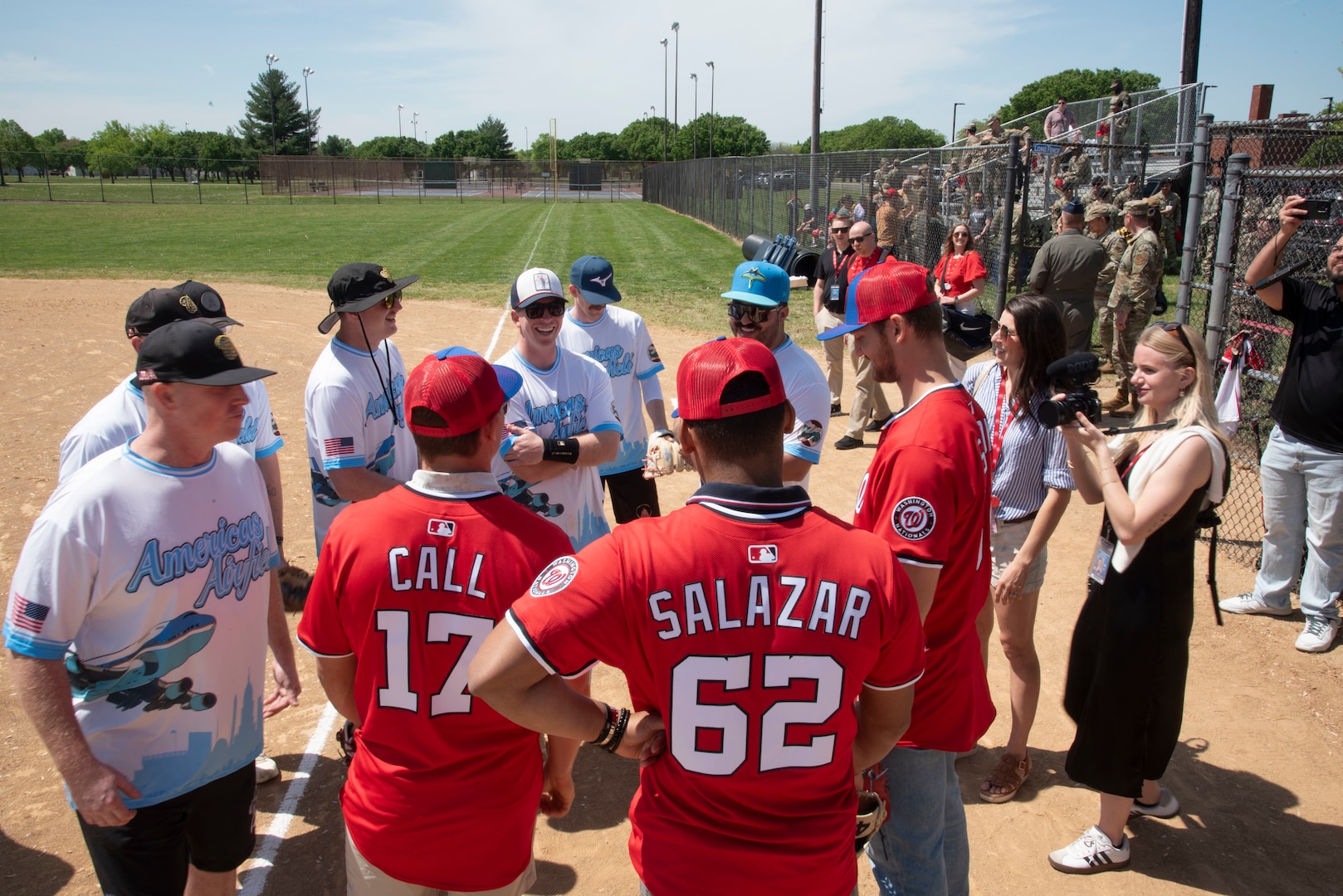 The “America’s Airfield” intermural softball team meets Alex Call, Eduardo Salazar and Michael Soroka of the Washington Nationals at Joint Base Andrews, Md., April 23, 2025. The teams played catch before the Nationals signed autographs for service members and families.
