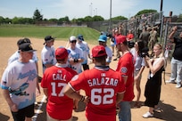 The “America’s Airfield” intermural softball team meets Alex Call, Eduardo Salazar and Michael Soroka of the Washington Nationals at Joint Base Andrews, Md., April 23, 2025. The teams played catch before the Nationals signed autographs for service members and families.