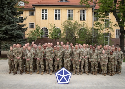 Members of the V Corps Command Team and senior staff members stand together for a group photo with senior leaders from the 1st Armored Division and various supporting units during the Spring Senior Leaders Forum, April 25, 2025, Camp Kościuszko, Poland. Over the course of two learning days, senior leaders used the opportunity to discuss talking points such as crisis response, interoperability, and sustaining over distance. As the forum concluded, leaders were ready to further bolster their unit’s readiness within Victory Corps’ area of operations across Europe. (U.S. Army photo by Sgt. Devin Klecan)