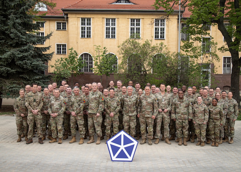 Members of the V Corps Command Team and senior staff members stand together for a group photo with senior leaders from the 1st Armored Division and various supporting units during the Spring Senior Leaders Forum, April 25, 2025, Camp Kościuszko, Poland. Over the course of two learning days, senior leaders used the opportunity to discuss talking points such as crisis response, interoperability, and sustaining over distance. As the forum concluded, leaders were ready to further bolster their unit’s readiness within Victory Corps’ area of operations across Europe. (U.S. Army photo by Sgt. Devin Klecan)