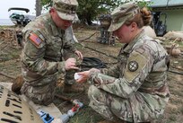 Spc. Colton Hines, left, and Sgt. Jessica Shields, water purifications specialists with the 935th Aviation Support Battalion, Missouri Army National Guard, check the chlorine levels of the water meant for cooking and cleaning laundry during TRADEWINDS 25 (TW25) exercise at Teteron Bay, Trinidad and Tobago, April 27, 2025.