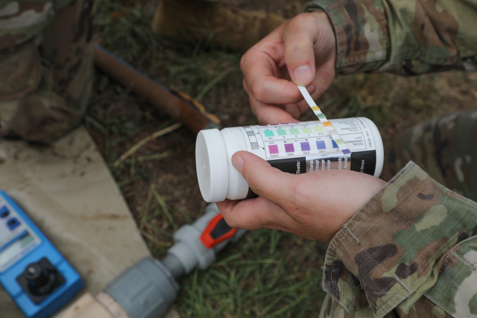 Sgt. Jessica Shields, a water purification specialist with the 935th Aviation Support Battalion, Missouri Army National Guard, checks the chlorine levels of the water meant for cooking and cleaning laundry during TRADEWINDS 25 exercise at Teteron Bay, Trinidad and Tobago, April 27, 2025.