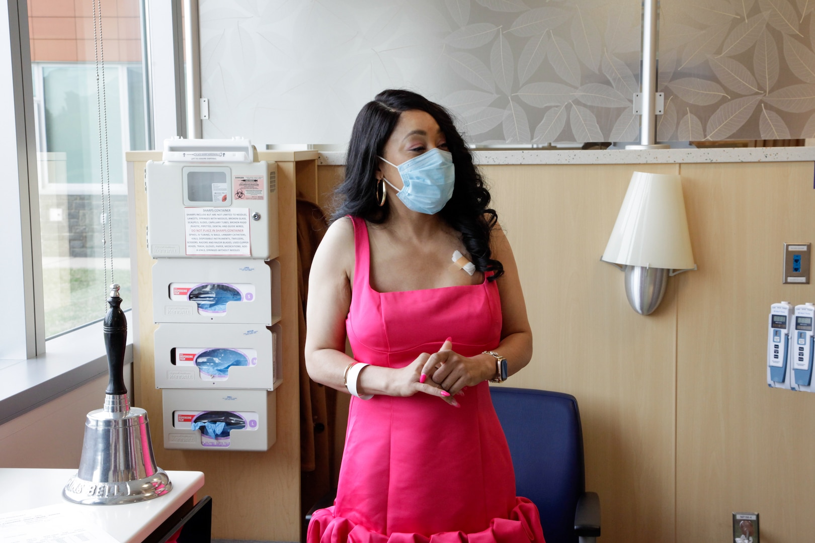 Dressed in her pink ball gown and heels, a patient of the ATAMMC Hematology/Oncology Clinic prepares to ring the bell marking the end of her cancer therapy treatment April 10, 2025.