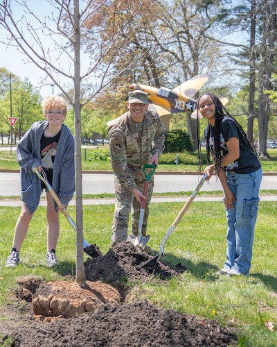 Image of people planting a tree