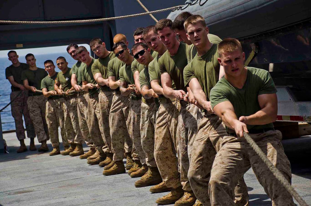 U.S. Marines assigned to the 24th Marine Expeditionary Unit (24th MEU) embarked aboard the amphibious transport dock ship USS New York (LPD 21) heave a messenger line during a replenishment at sea with the Military Sealift Command fleet replenishment oiler USNS Rappahannock (T-AO 204). New York is part of the Iwo Jima Amphibious Ready Group with the embarked 24th MEU and is deployed in support of maritime security operations and theater security cooperation efforts in the U.S. 5th Fleet area of responsibility. (U.S. Navy photo by Mass Communication Specialist Seaman Cyrus Roson/Released)