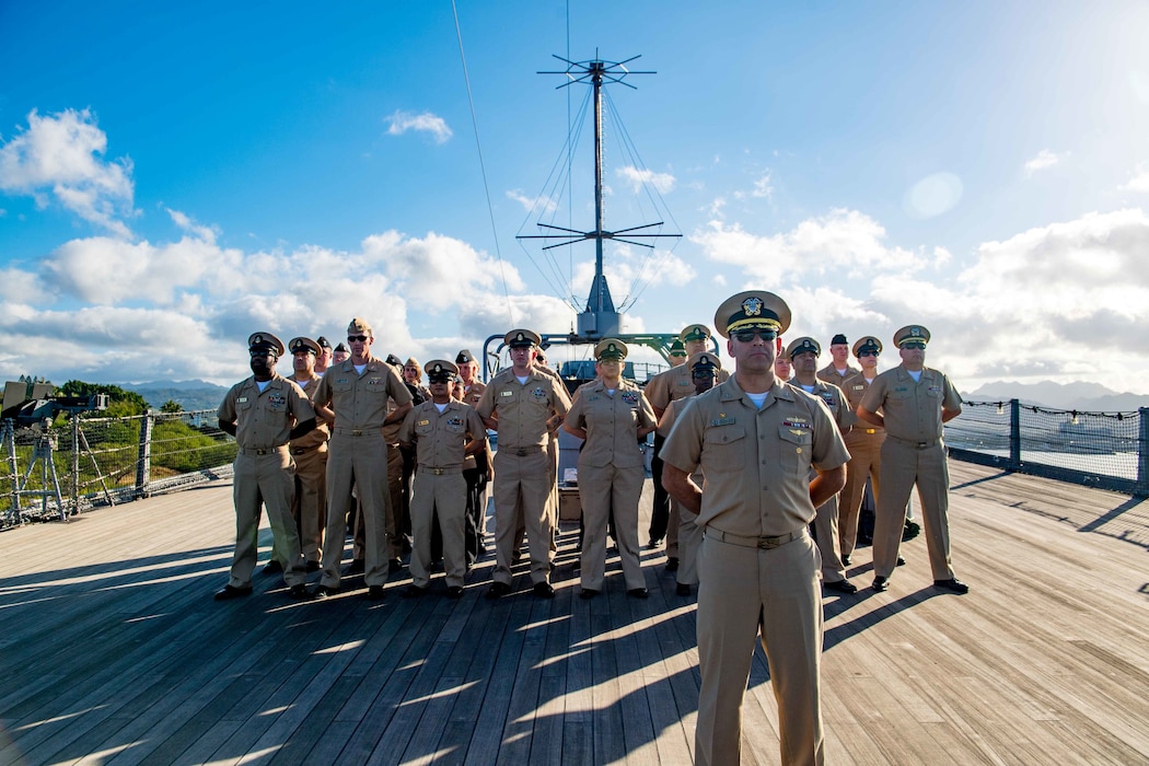 PEARL HARBOR, Hawaii (Apr. 4, 2019) Capt. Andrew Carlson, commanding officer of guided-missile destroyer USS Zumwalt (DDG 1000) and Zumwalt Sailors stand in formation aboard before morning colors aboard the USS Missouri Memorial.  Zumwalt is conducting the port visit as part of its routine operations in the eastern Pacific. Zumwalt-class destroyers provide the Navy with agile military advantages at sea and with ground forces ashore. (U.S. Navy photo by Mass Communications Specialist 2nd Class Jonathan Jiang)