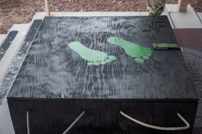 Large black box with jolly green feet painted on top.