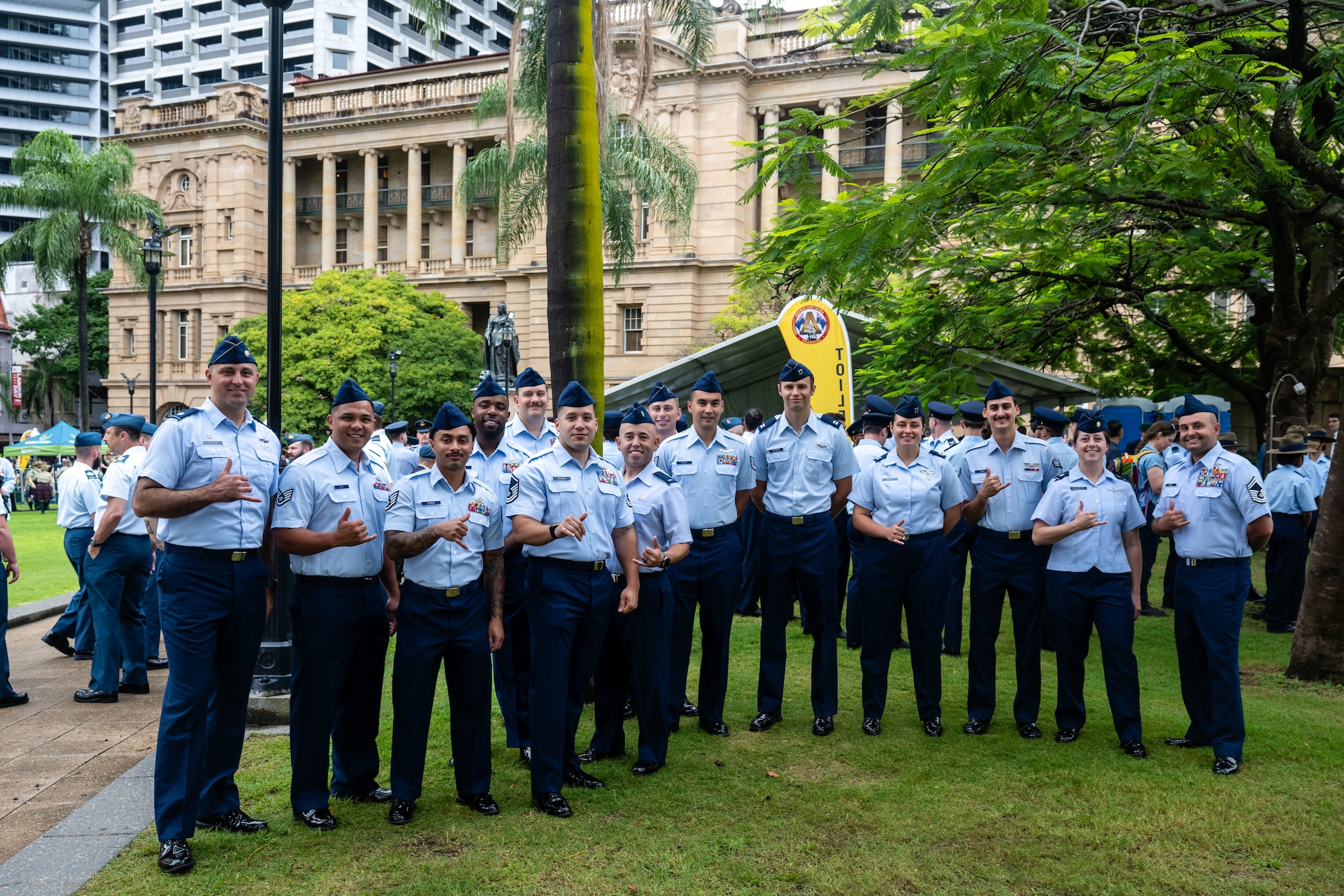 U.S. Air Force Airmen pose for a photo along side Royal Australian Air Force members during New Zealand Army Corps day in Brisbane.