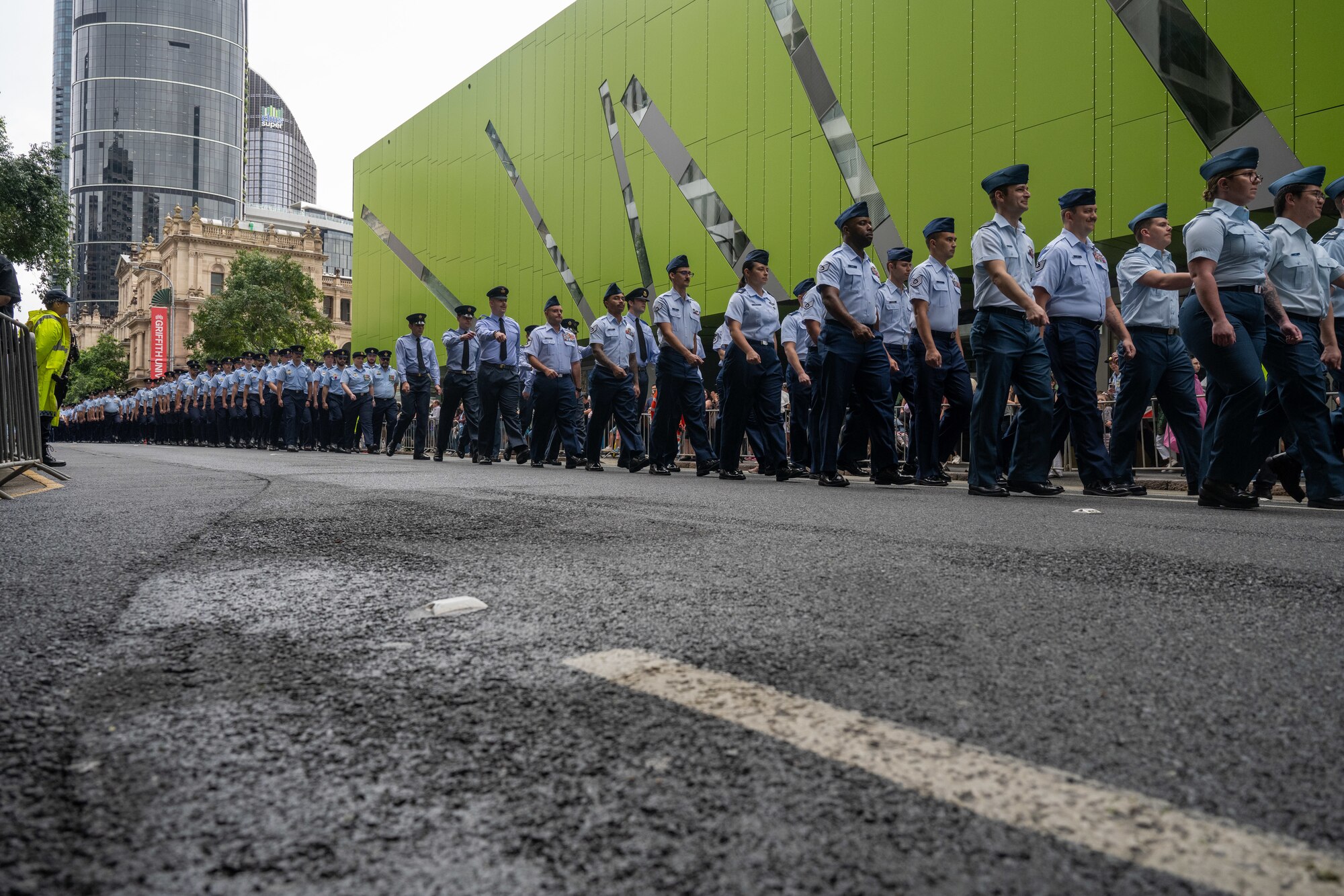 U.S. Air Force Airmen march along side Royal Australian Air Force members during New Zealand Army Corps day in Brisbane.