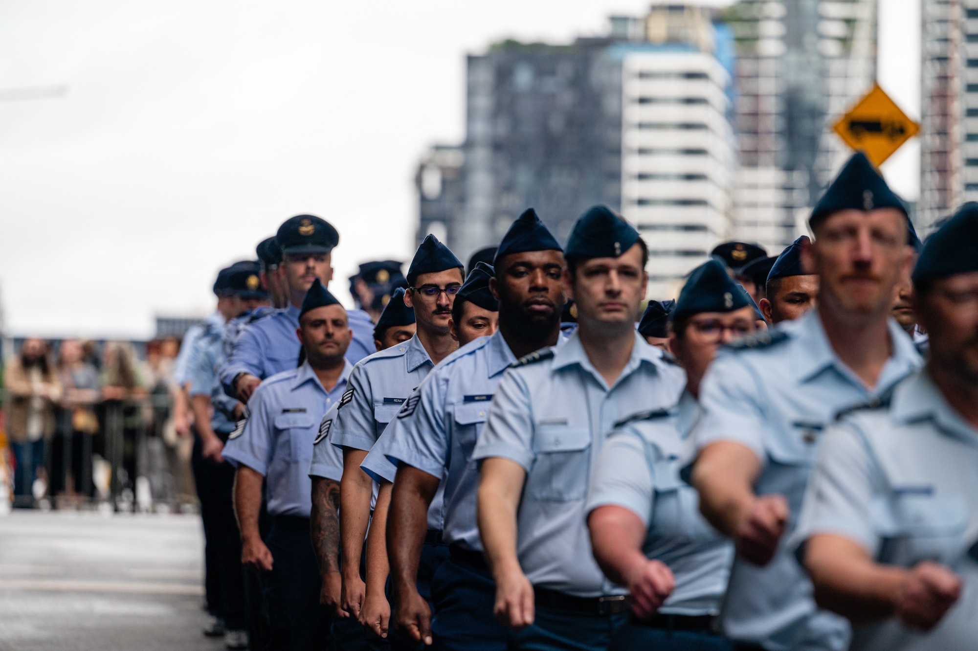 U.S. Air Force Airmen march along side Royal Australian Air Force members during New Zealand Army Corps day in Brisbane.
