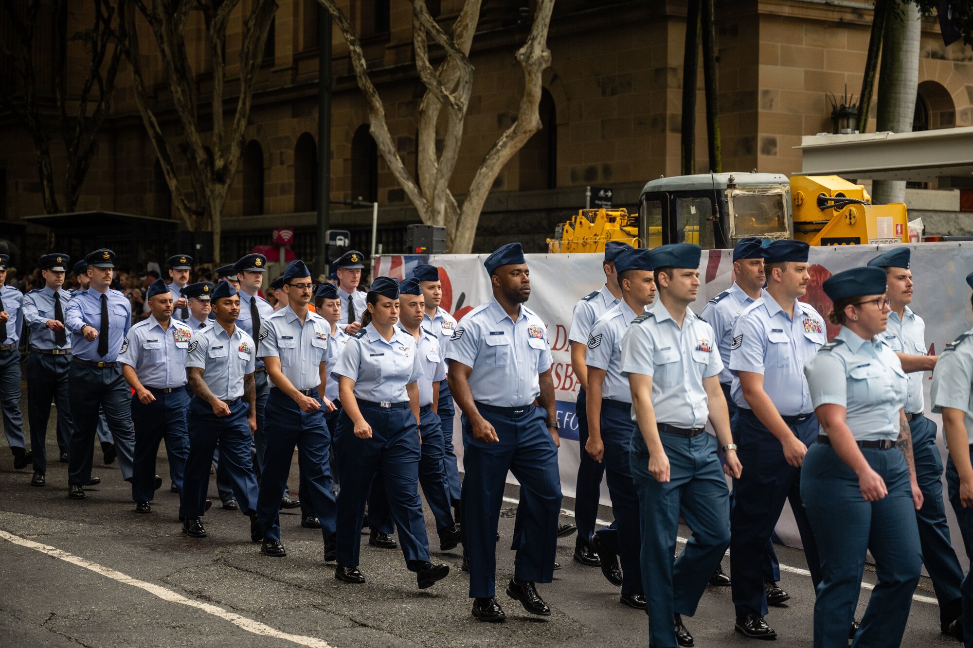 U.S. Air Force Airmen march along side Royal Australian Air Force members during New Zealand Army Corps day in Brisbane.