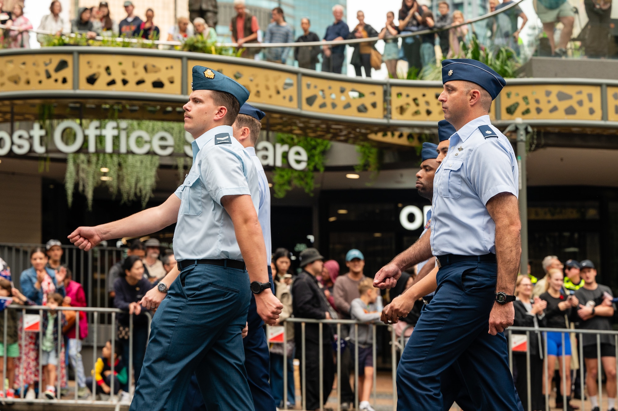 U.S. Air Force Airmen march along side Royal Australian Air Force members during New Zealand Army Corps day in Brisbane.