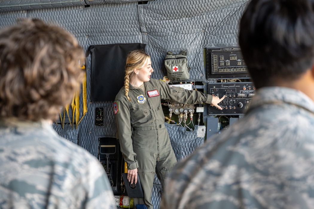 A US Airman shows JROTC cadets a C5