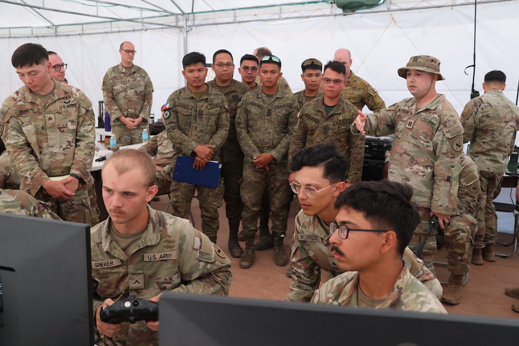 U.S. Army Capt. Bray McCollum briefs members of the armed forces of the Philippines on the IFPC-HPM and FS-LIDS at Naval Station Leovigildo Gantioqui Apr. 25, 2025.