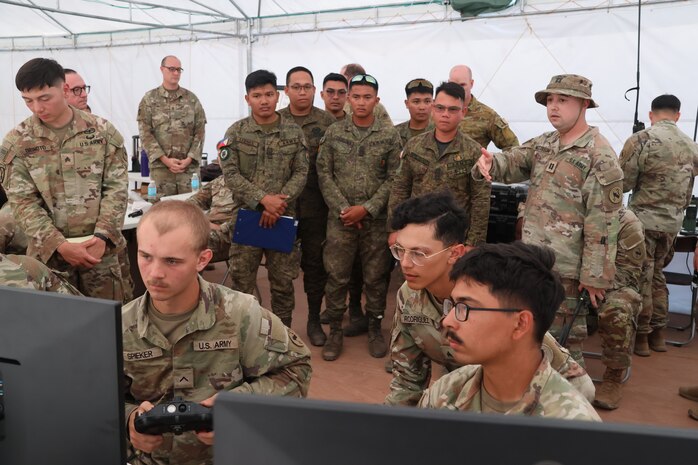 U.S. Army Capt. Bray McCollum briefs members of the armed forces of the Philippines on the IFPC-HPM and FS-LIDS at Naval Station Leovigildo Gantioqui Apr. 25, 2025.