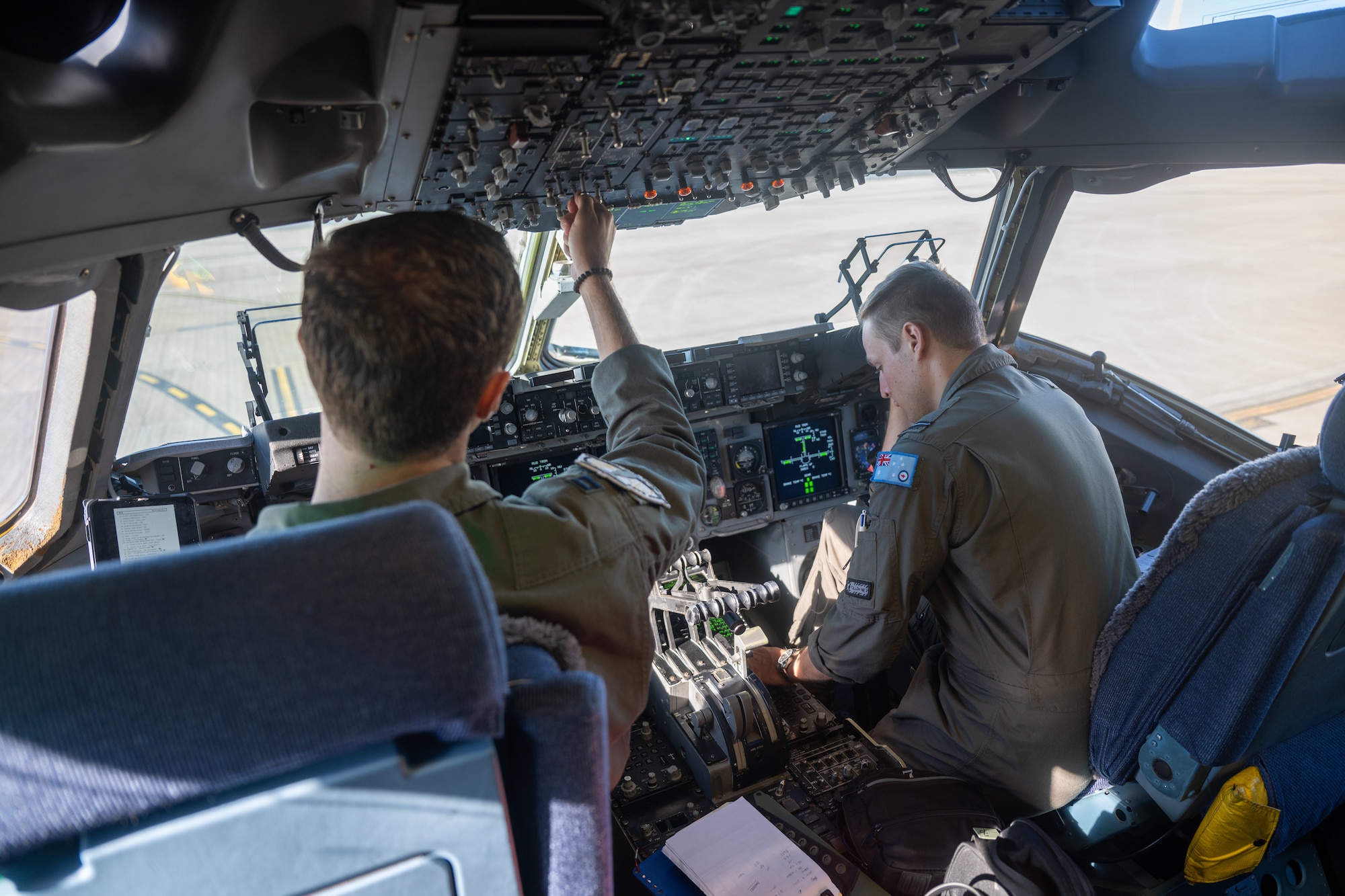 A U.S. Air Force and Royal Australian Air Force member go through their pre-flight check list during Global Dexterity 25.
